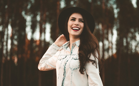 Smiling woman in hat from Alexandria family dentistry at Center for Dental Anesthesia