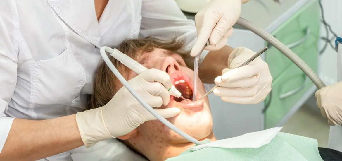 Young patient receives a dental check-up in a modern dental office